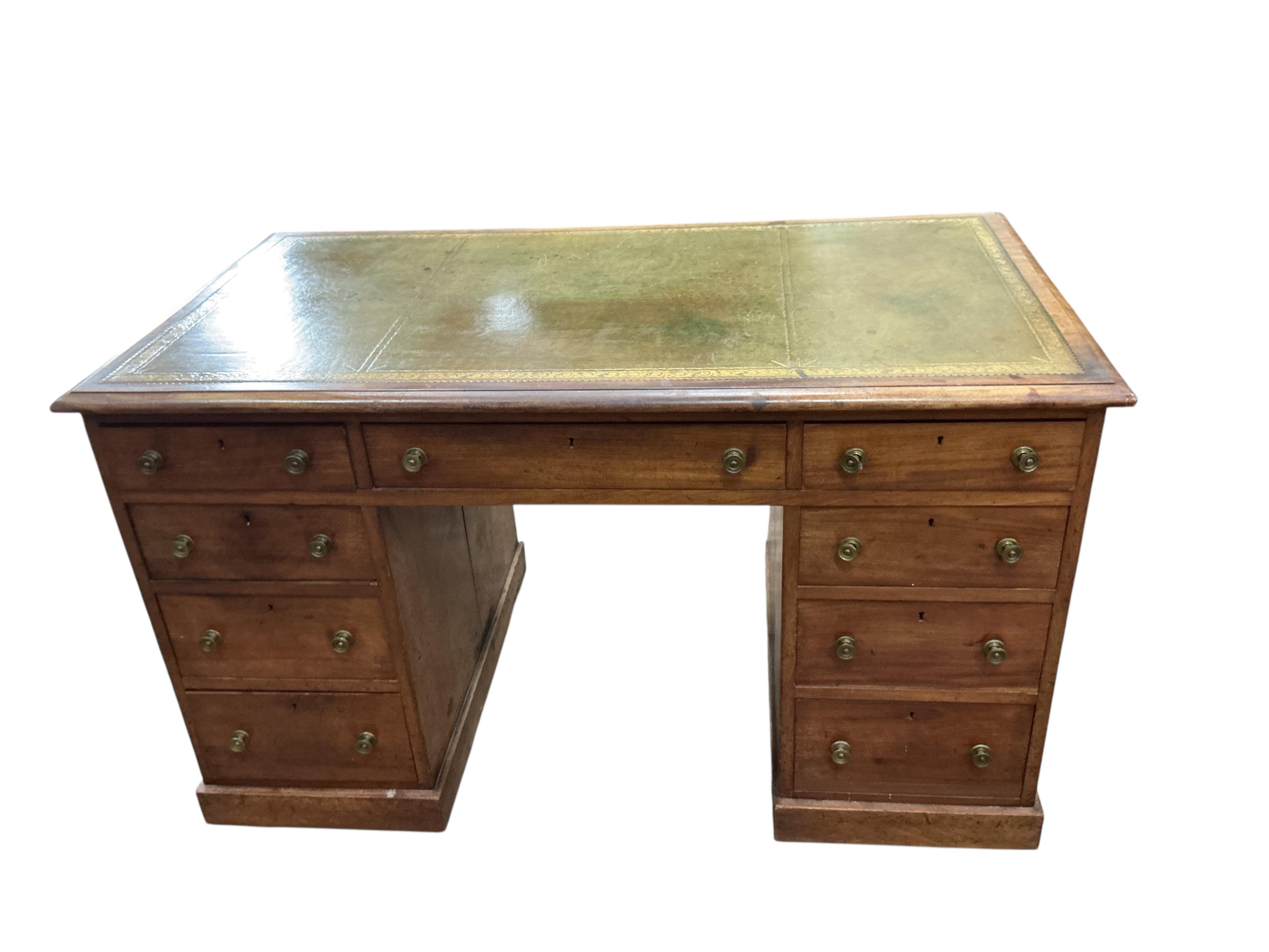 A Victorian faded mahogany kneehole desk with leather inset top, width 127cm, depth 71cm, height 77cm